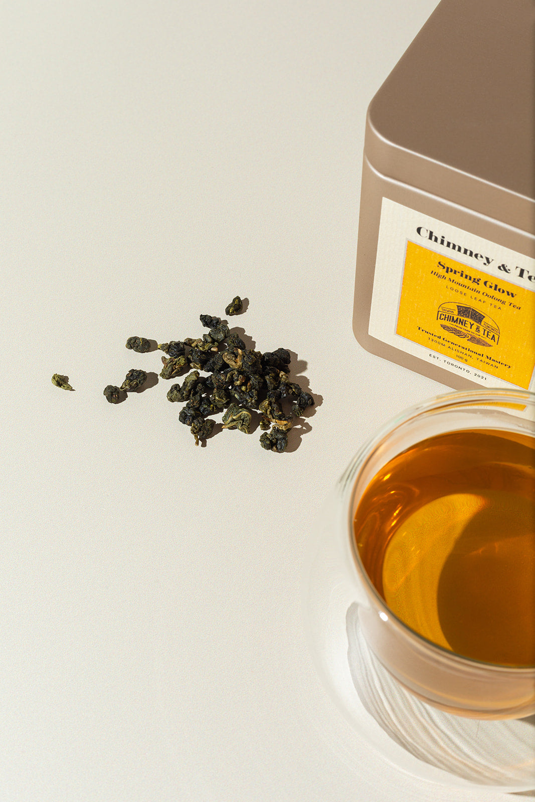Chimney & Tea Spring Glow High Mountain Oolong Tea loose leaf and tin packaging